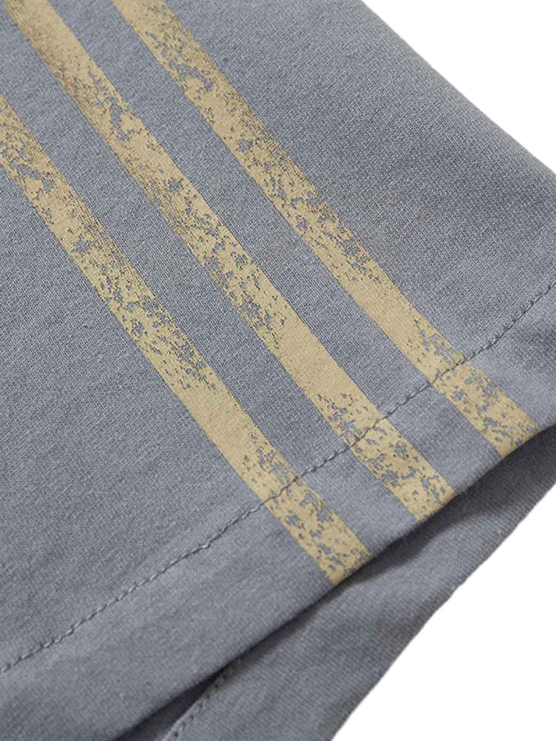 Zoomed-in view of TALISHKO T-shirt's sporty stripes, showcasing stylish texture detail.