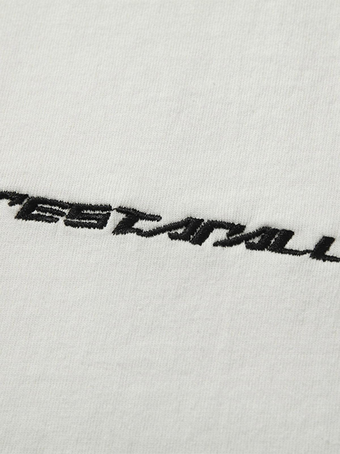 Close-up of the TALISHKO T-shirt's embroidery, showcasing its unique style and texture.