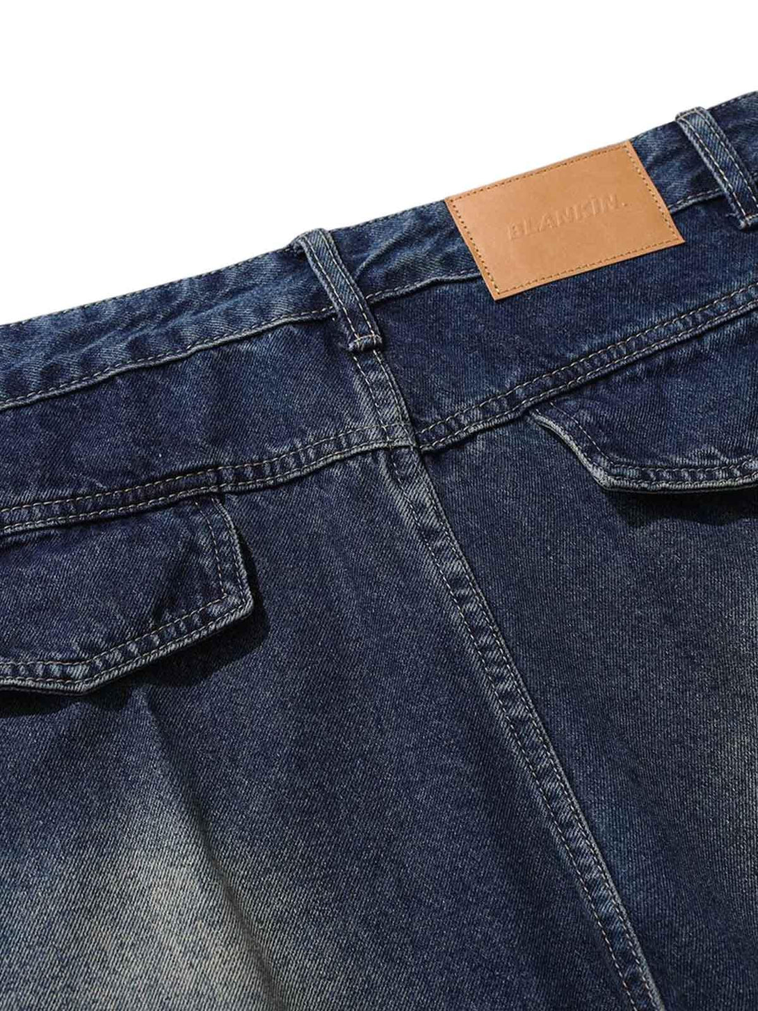 Close-up of TALISHKO's heavy washed workwear jeans, featuring back pocket details.