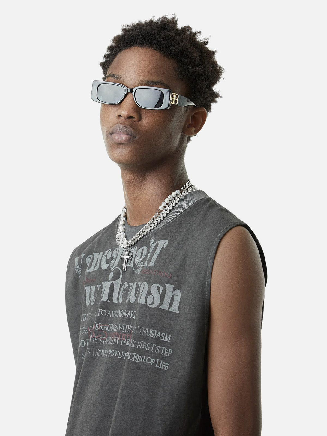 Model wearing TALISHKO's washed gray vest with retro typography, ideal for effortless summer style.
