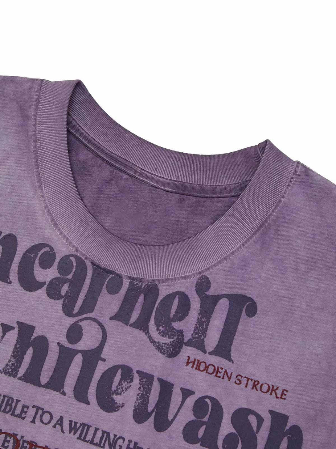 A detailed view of TALISHKO's purple vest, showcasing retro typography and fabric texture.