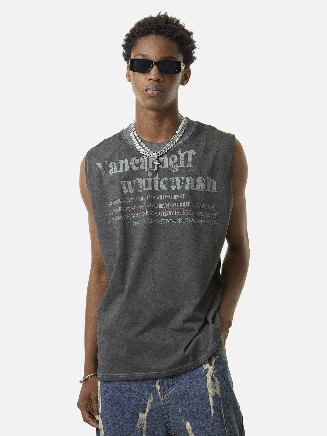 Model wearing TALISHKO's gray vest with retro print, styled with denim for a casual look.