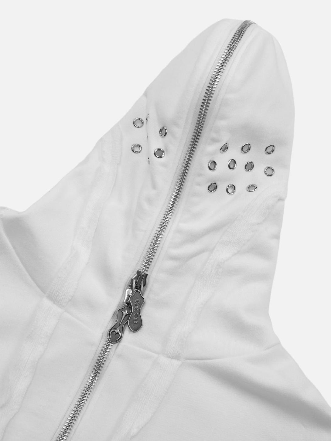 Intricate look at the grommet details and zipper of a white distressed hoodie by TALISHKO.