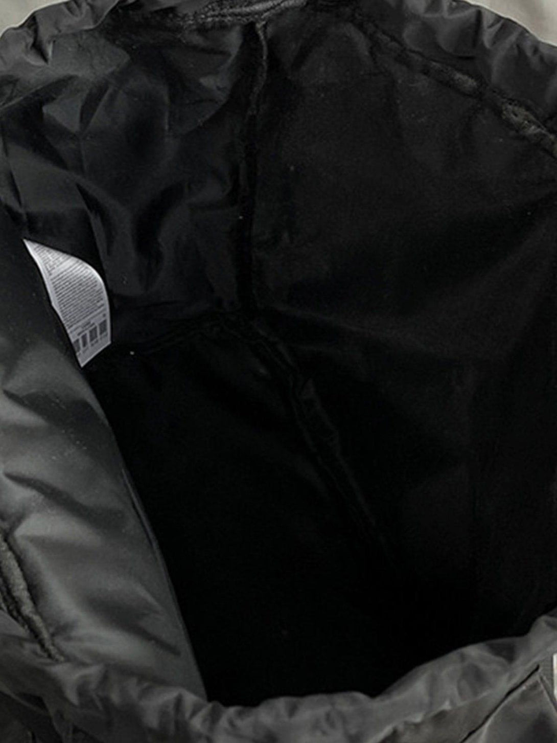 Intricate look at the interior of TALISHKO's high-capacity backpack, highlighting its roomy design.