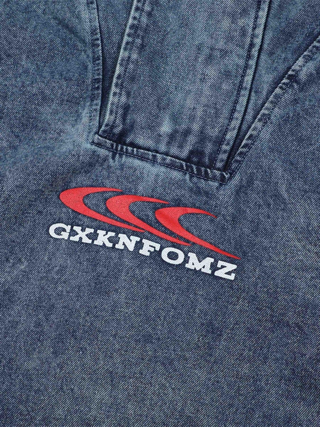 Intricate look at TALISHKO's high-neck hooded denim jacket, highlighting logo detail and texture.