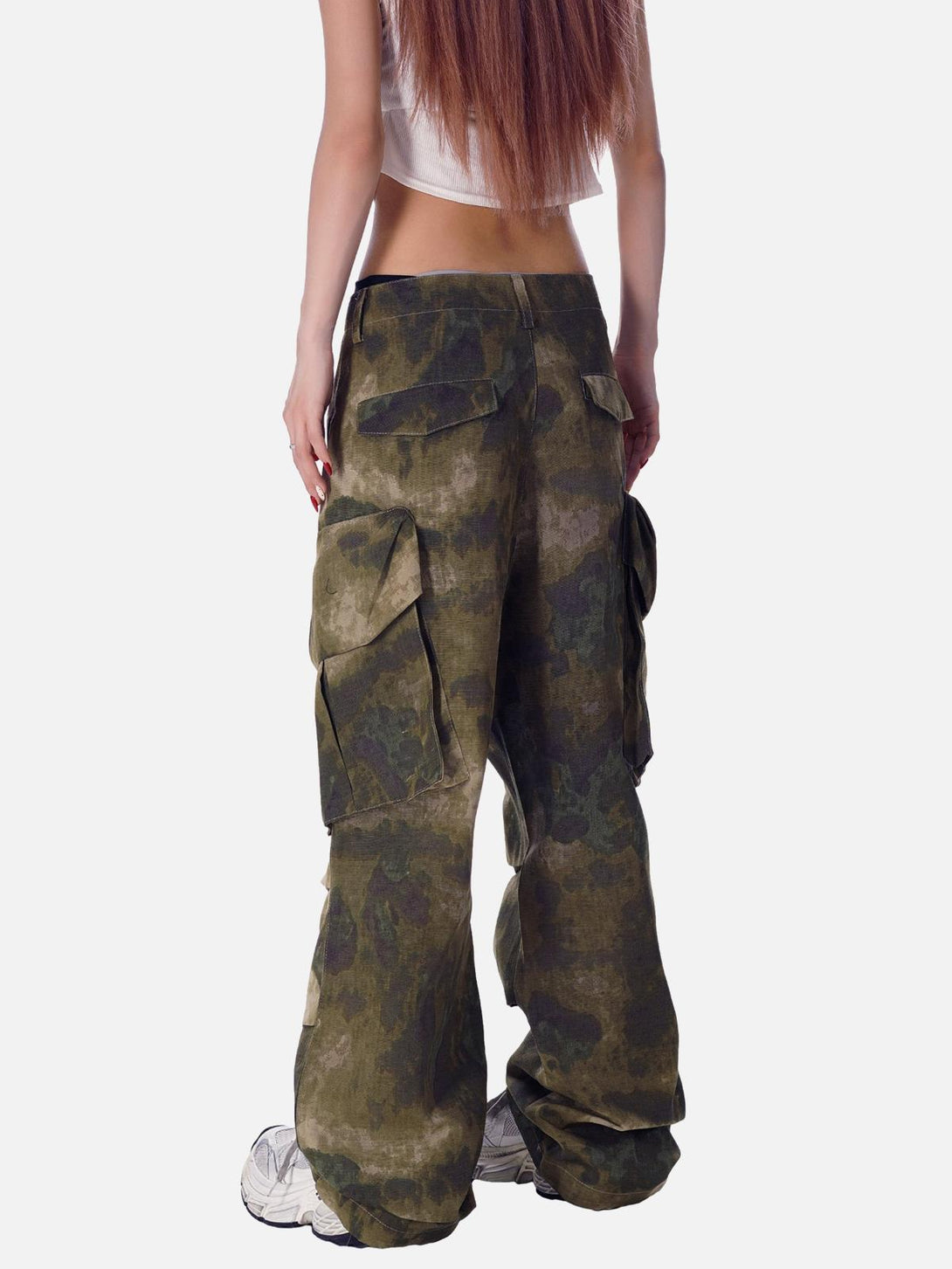 Model wearing TALISHKO camouflage pants with a multi-pocket design and relaxed fit.