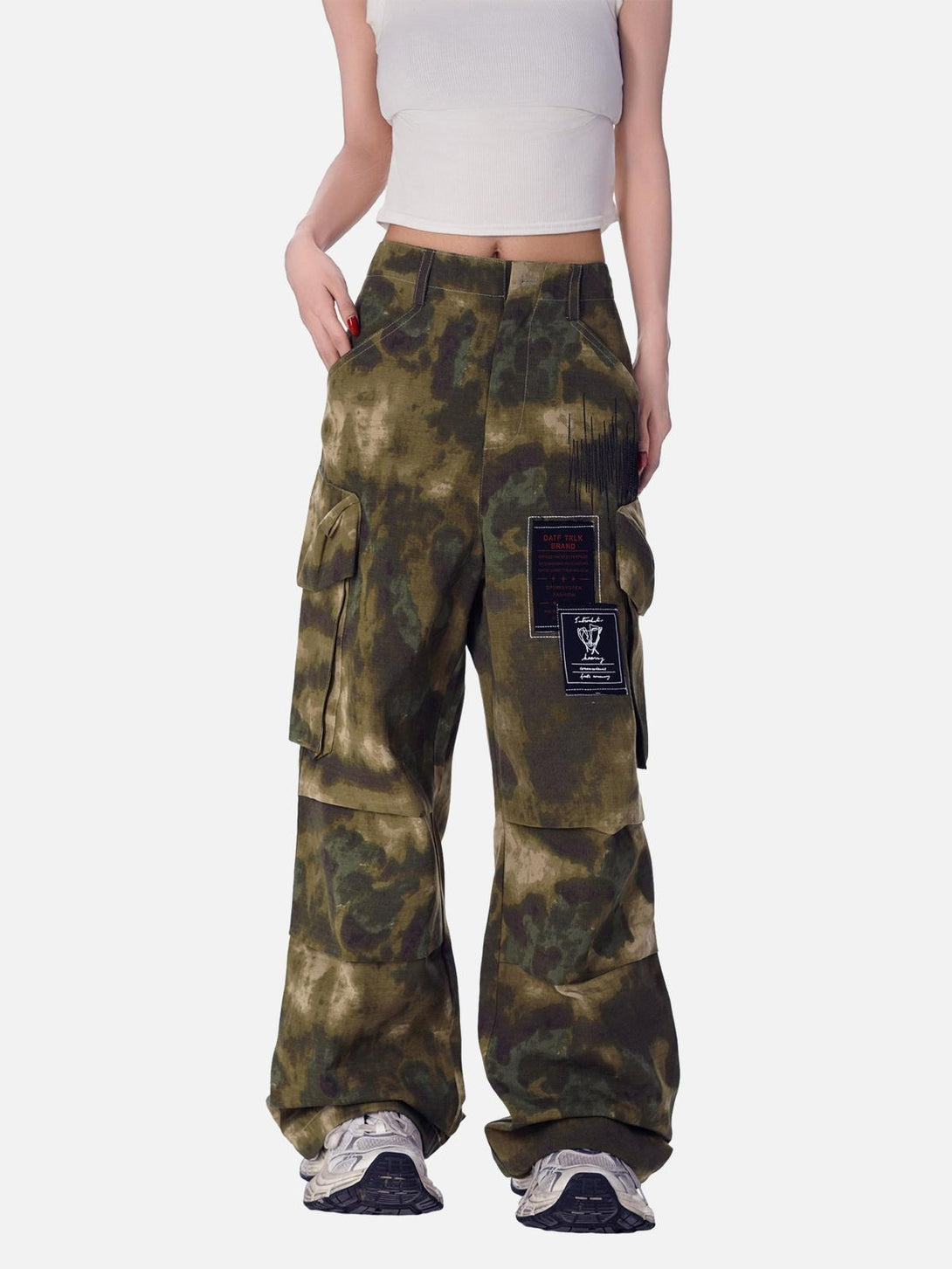 TALISHKO's high street camouflage pants with a bold multi-pocket design worn by a model.