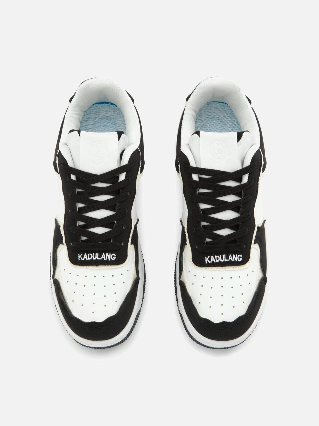 Top view of TALISHKO's black and white casual shoes, featuring bold laces and branding.