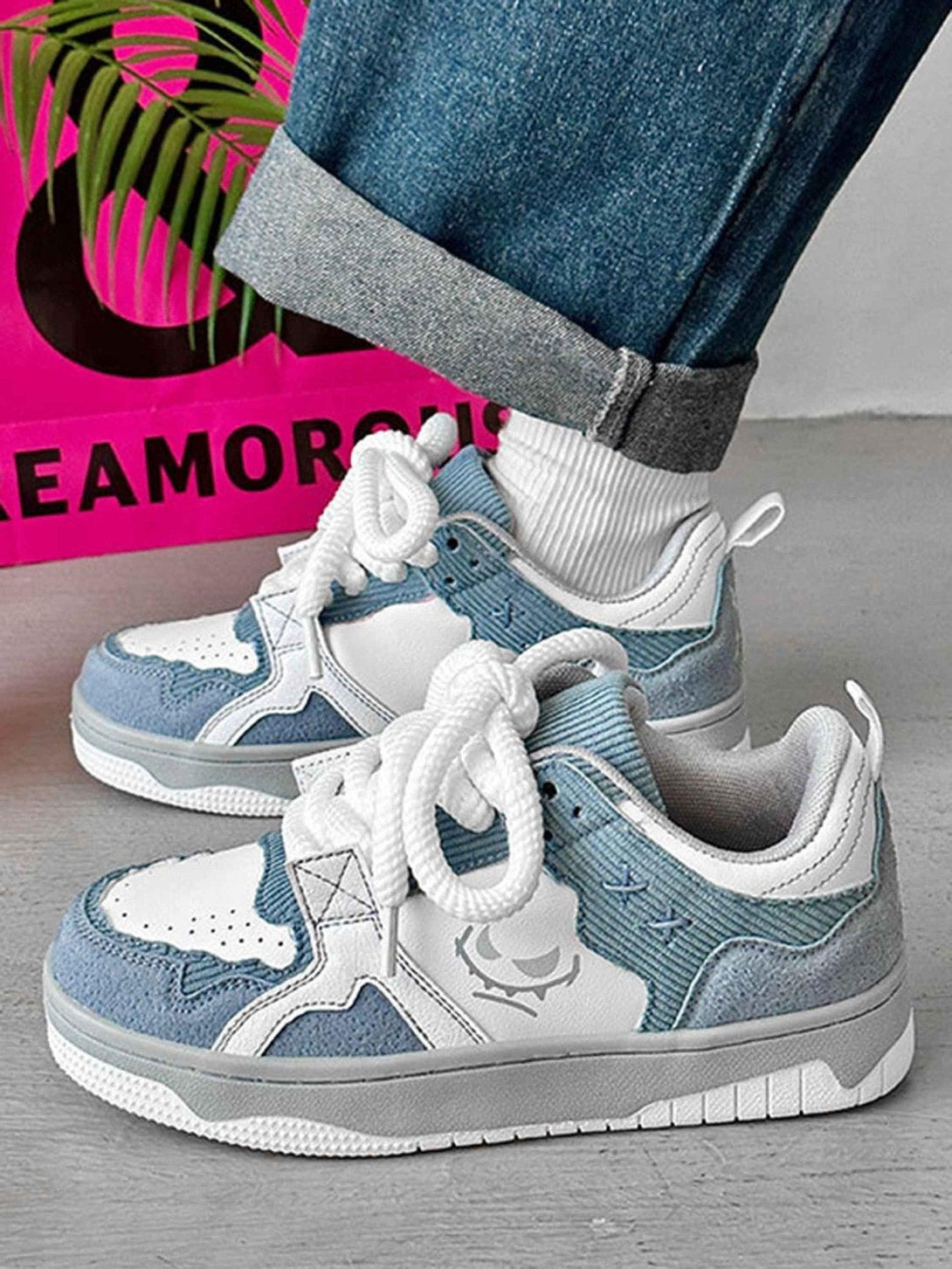 Casual look with TALISHKO board shoes, showcasing blue and white design with thick soles.