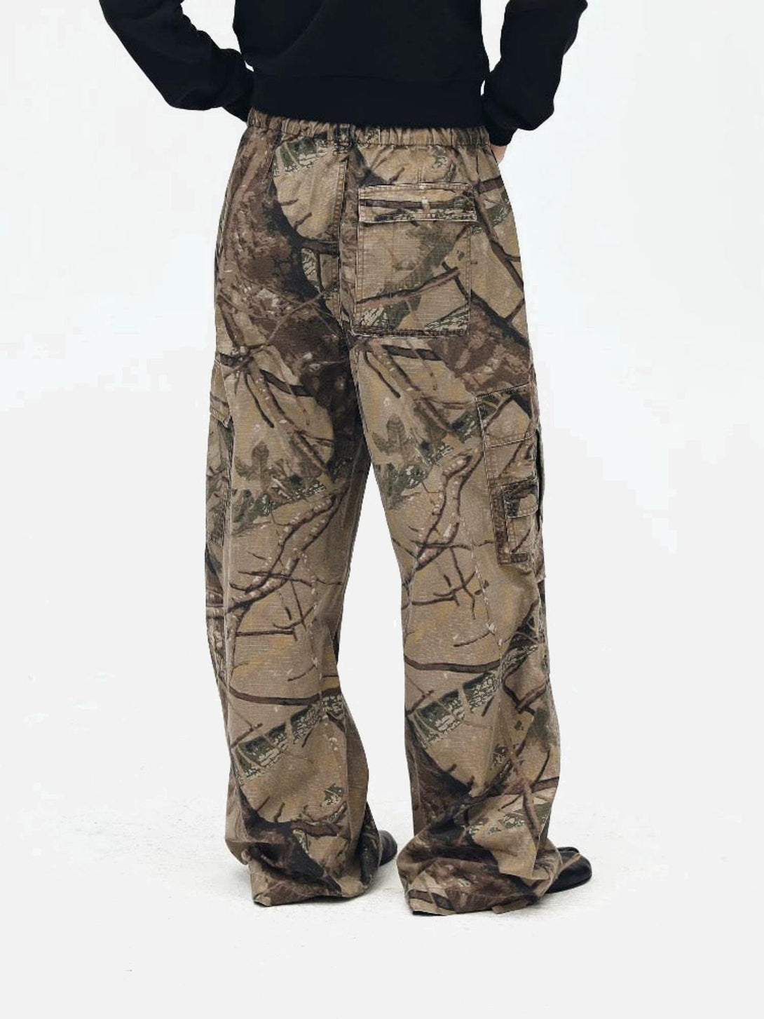 Back view of TALISHKO camouflage casual pants, highlighting the relaxed fit and nature-inspired pattern.