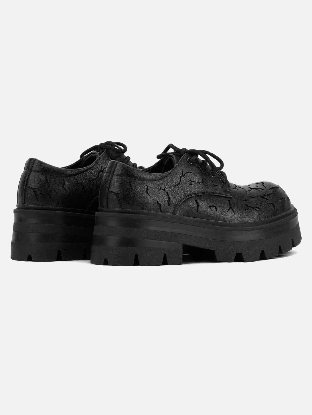 Back view of TALISHKO crackle leather shoes, emphasizing the textured design and chunky soles.