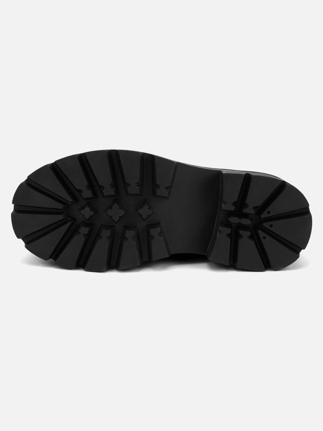 A detailed look at the sole of TALISHKO's crackle leather shoes, featuring durable traction.