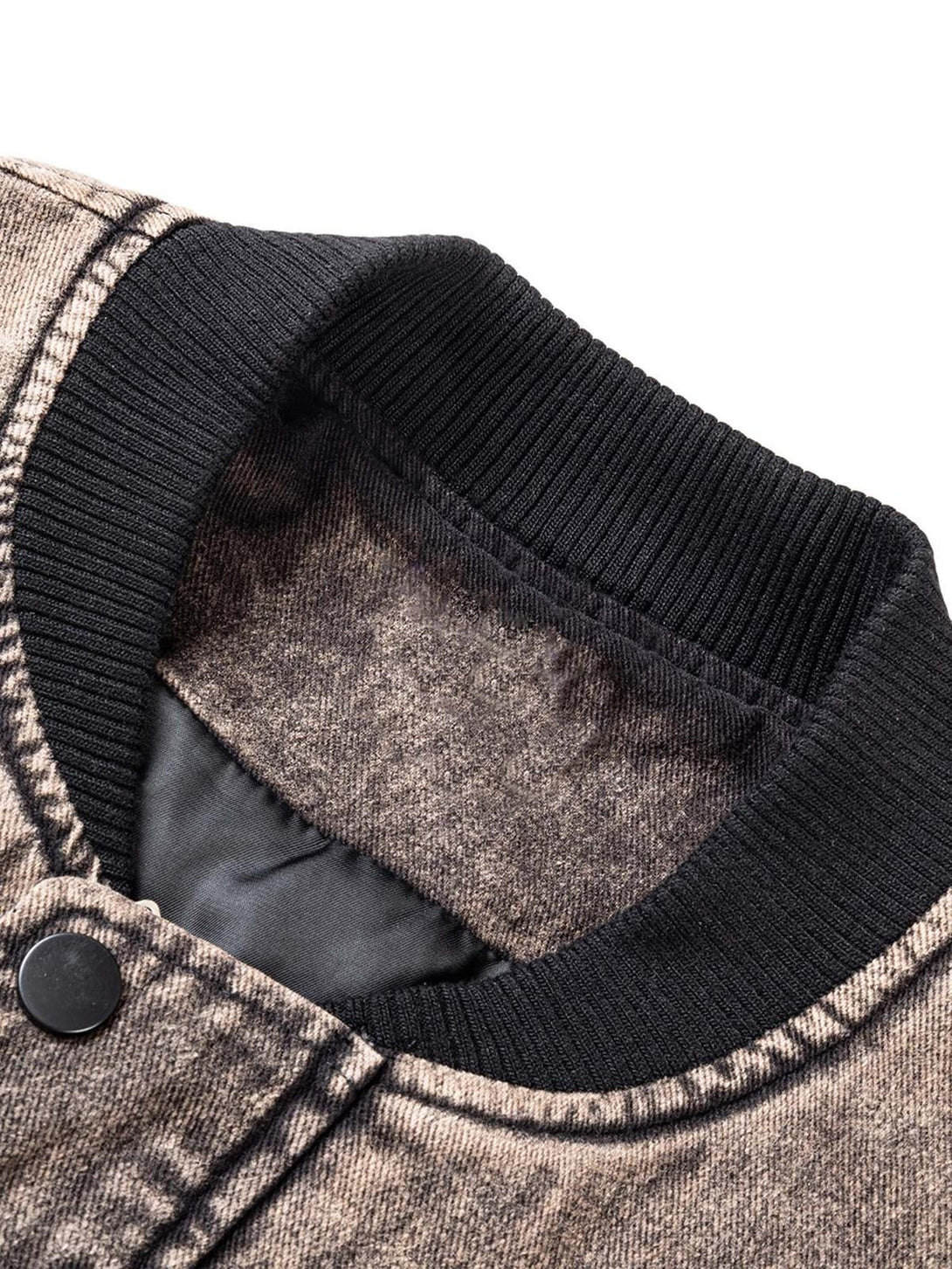 Detailed view of a TALISHKO work jacket collar, highlighting the ribbed texture and button detail.