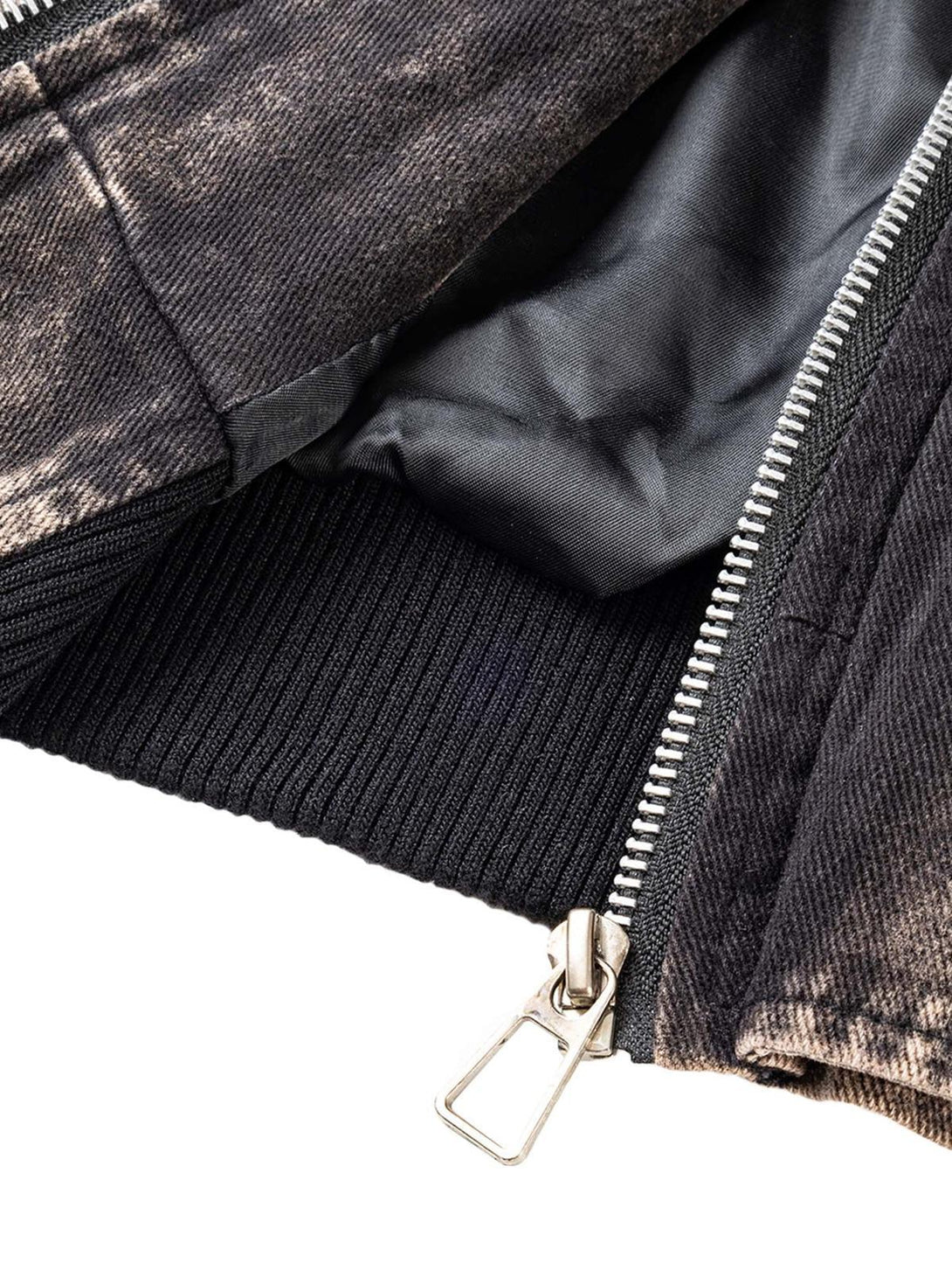 A detailed look at TALISHKO's distressed work jacket, highlighting the ribbed hem and zipper.