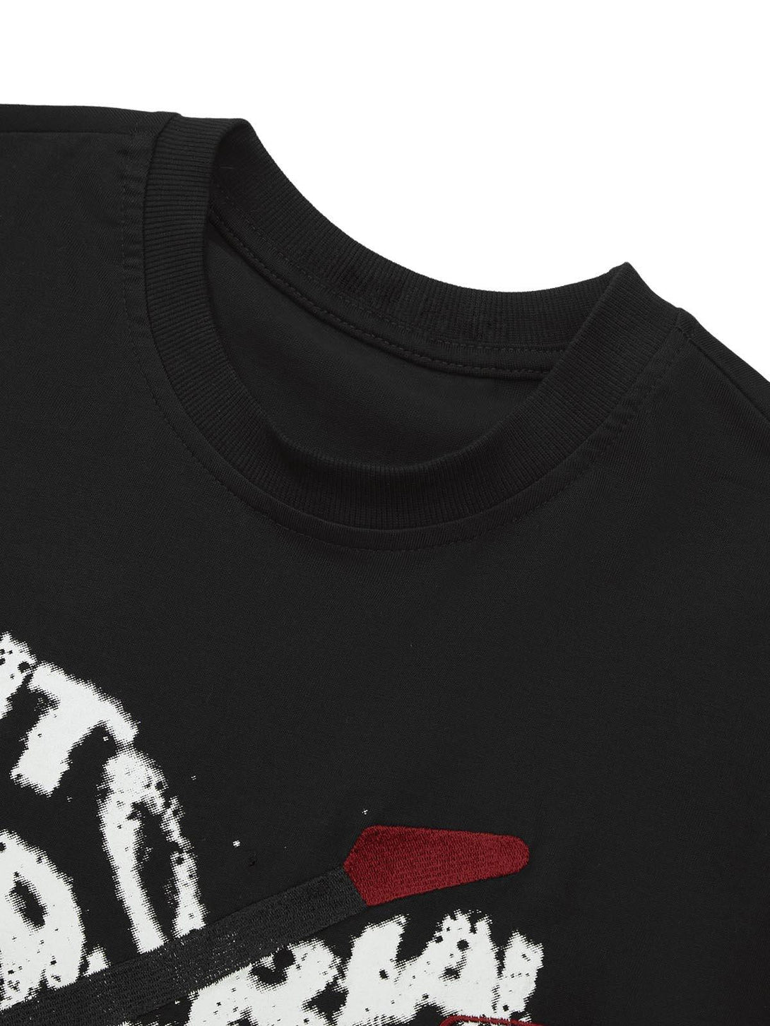 A detailed view of TALISHKO's black T-shirt, featuring unique embroidery and graphic print.