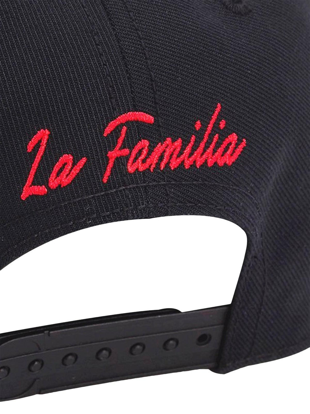Detailed view of TALISHKO cap's back, showcasing bold red "La Familia" embroidery.