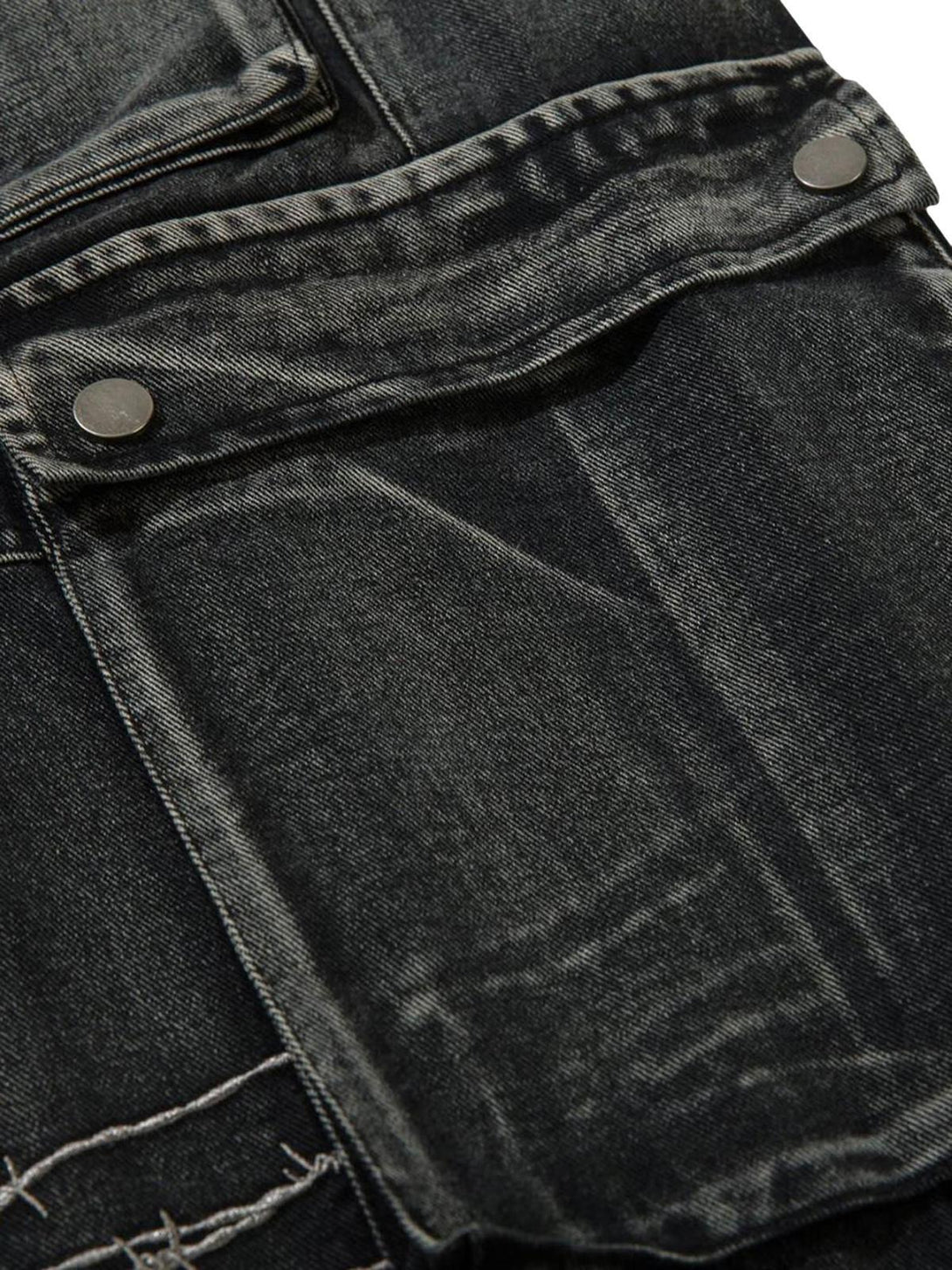Zoomed-in texture of TALISHKO hip-hop jeans highlighting the detailed pocket design.