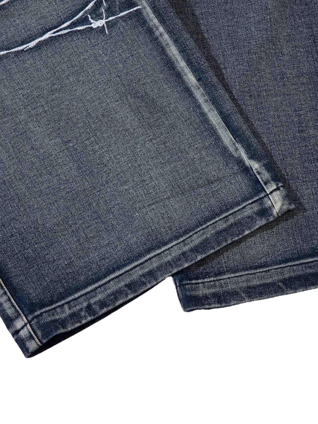 Detailed fabric and stitching on TALISHKO hip-hop jeans, showcasing a stylish finish.