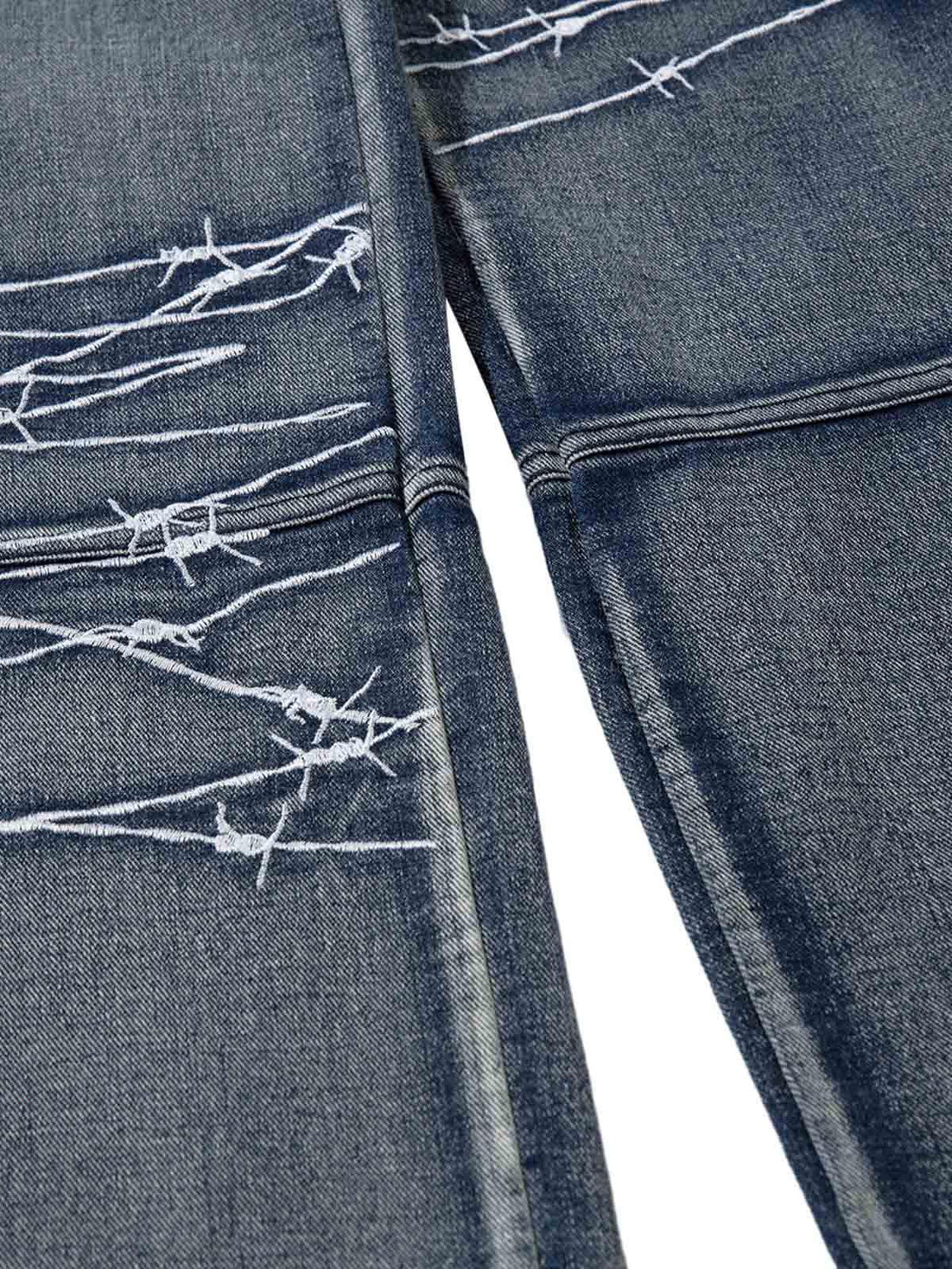 Intricate look at TALISHKO hip-hop jeans with barbed wire embroidery and textured denim.