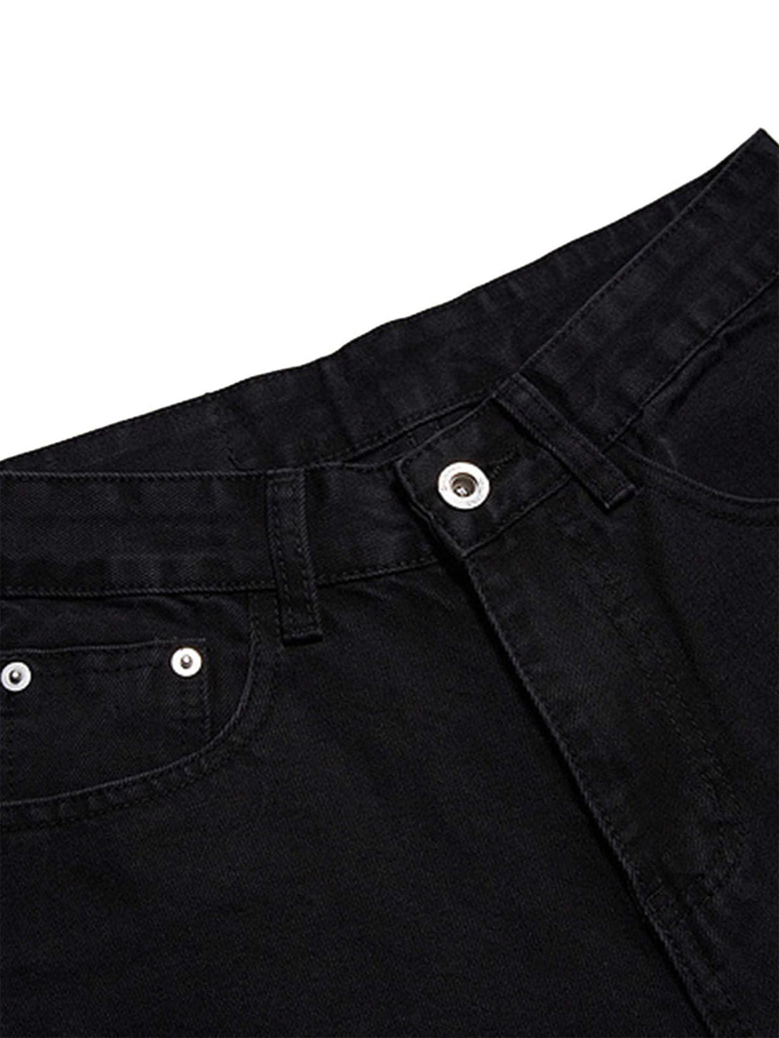 Close-up of black retro jeans by TALISHKO, highlighting sturdy fabric and classic rivet details.