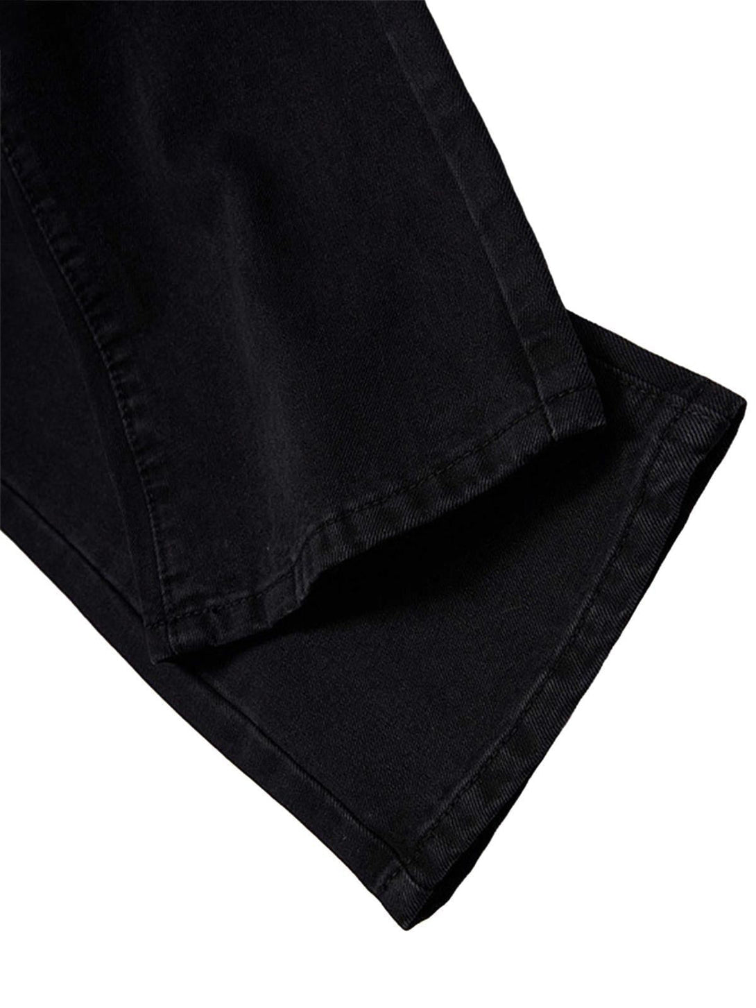 Detailed hem view of black retro jeans by TALISHKO, showcasing sturdy fabric construction.