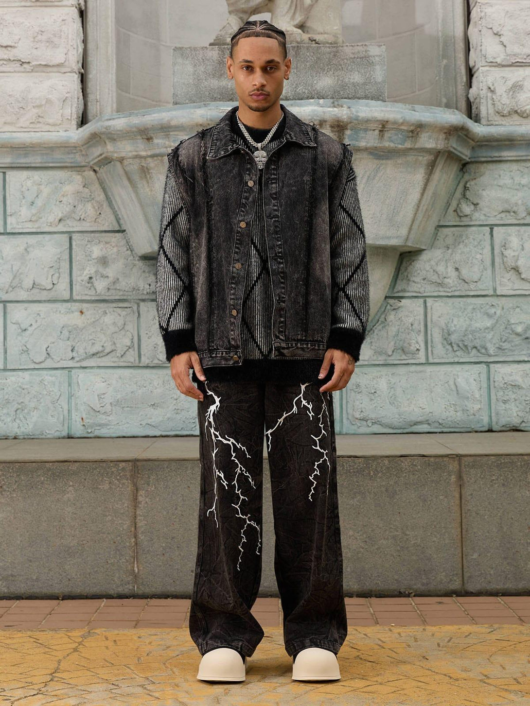 TALISHKO denim jacket and jeans with white lightning details, styled in a hip-hop fashion.