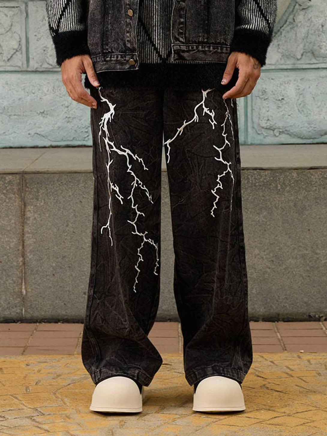 TALISHKO high street hip-hop jeans featuring white lightning patterns and a distressed look.
