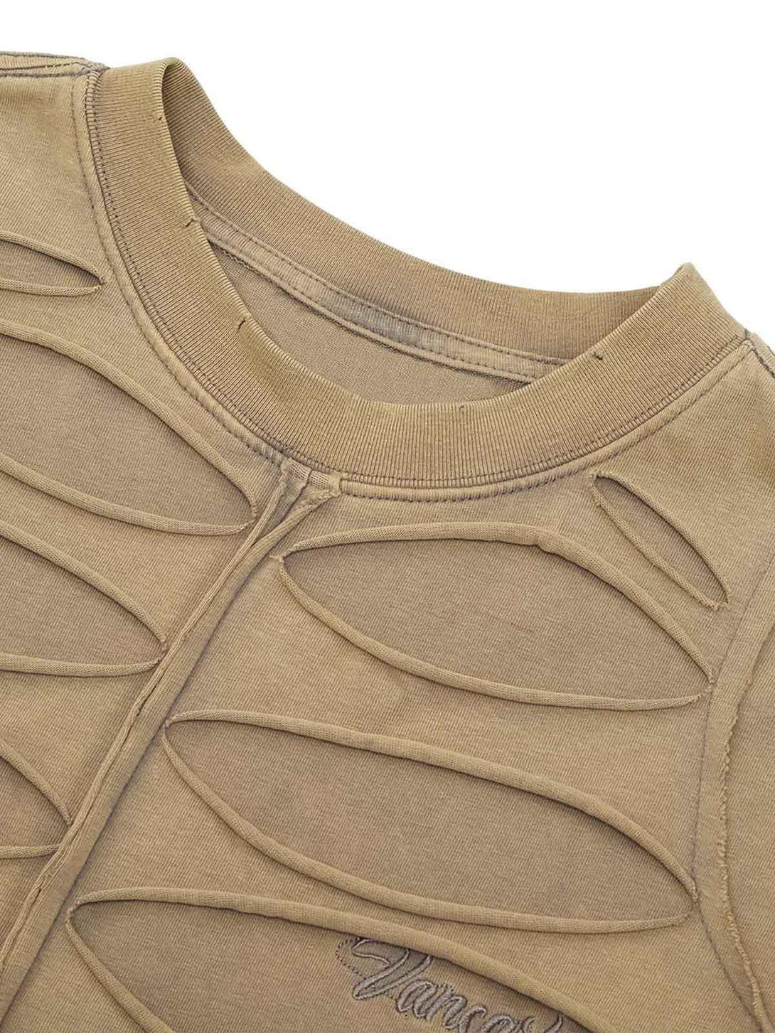 Detailed fabric and stitching of TALISHKO's hole design T-shirt showcasing unique style.
