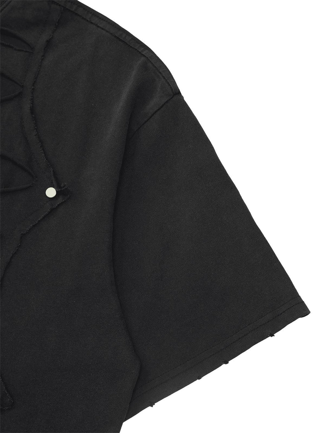 Focusing on the sleeve detail of TALISHKO's black T-shirt, showcasing edgy hip hop design.