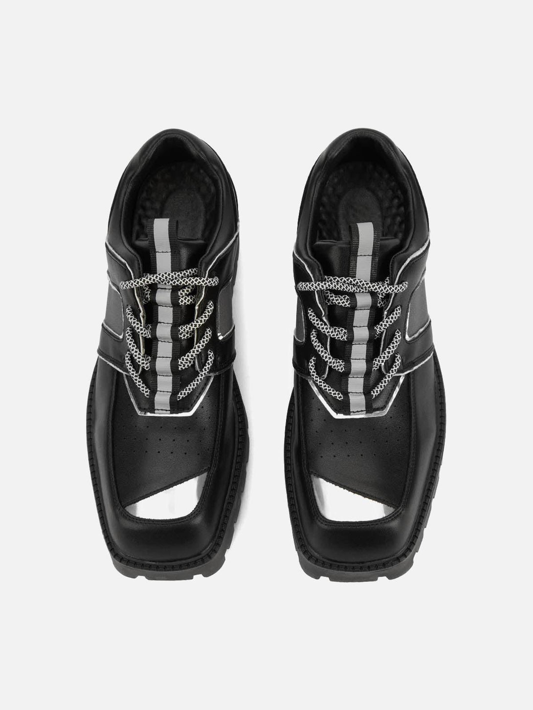 Top view of TALISHKO leather shoes featuring metal accents and unique lace design.