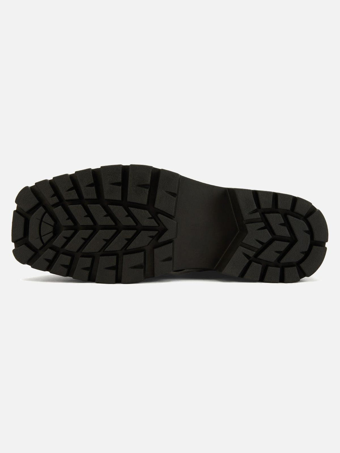Close-up of the rugged black sole on TALISHKO leather shoes, highlighting traction design.