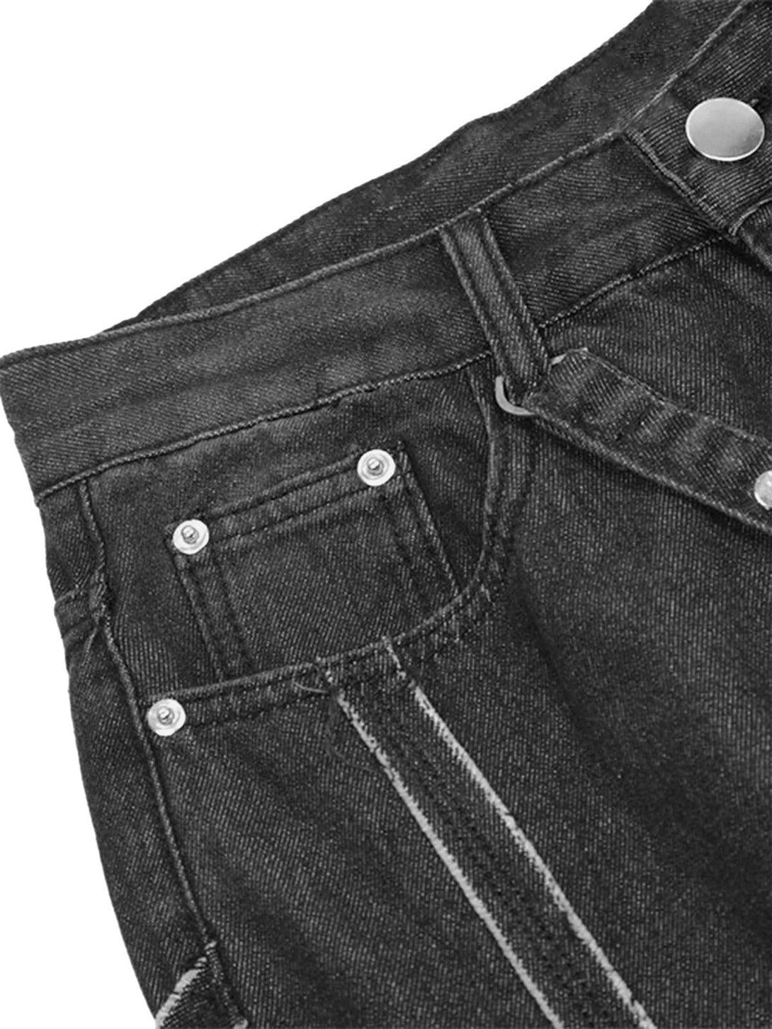 Detailed view of TALISHKO denim pants highlighting intricate stitching and texture.
