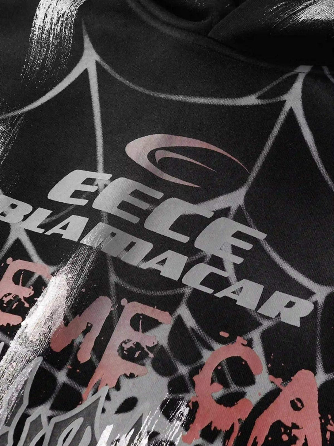 A close-up of the TALISHKO hoodie shows a bold spider web print with graphic details.