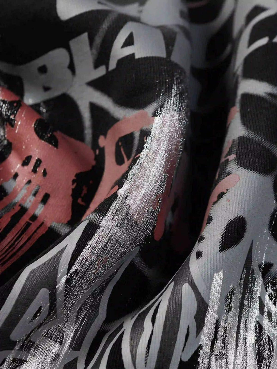 TALISHKO hoodie fabric showcasing intricate graphic details with a spider web pattern.