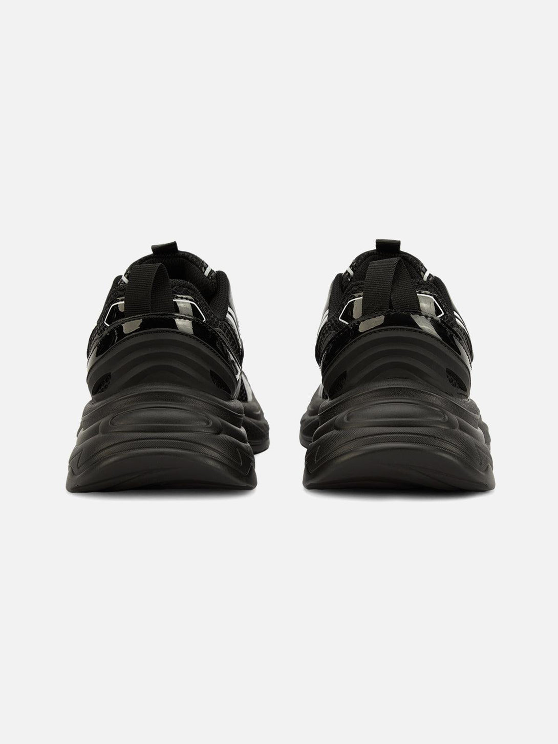 Rear perspective of TALISHKO hip hop sports shoes, highlighting sleek black design and bold style.