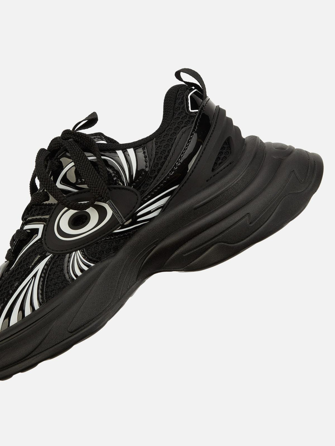 Dynamic design of black TALISHKO sports shoes with bold patterns, perfect for urban fashion.