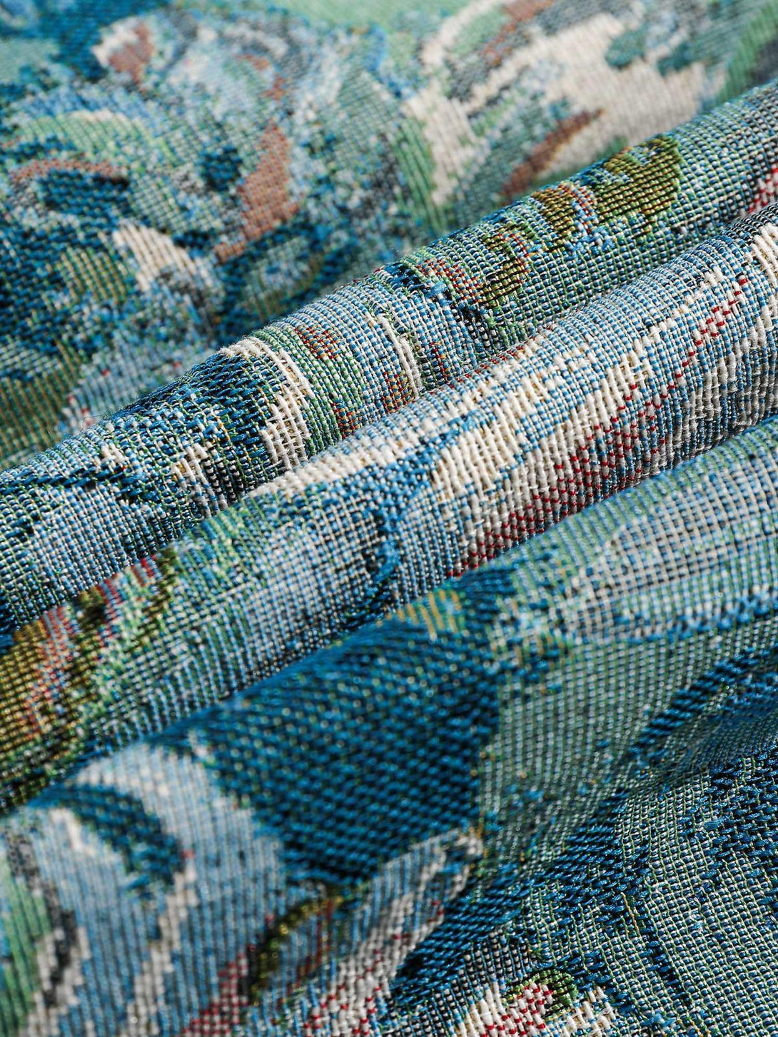 Detailed fabric and stitching on a TALISHKO jacquard jacket, highlighting its intricate texture.