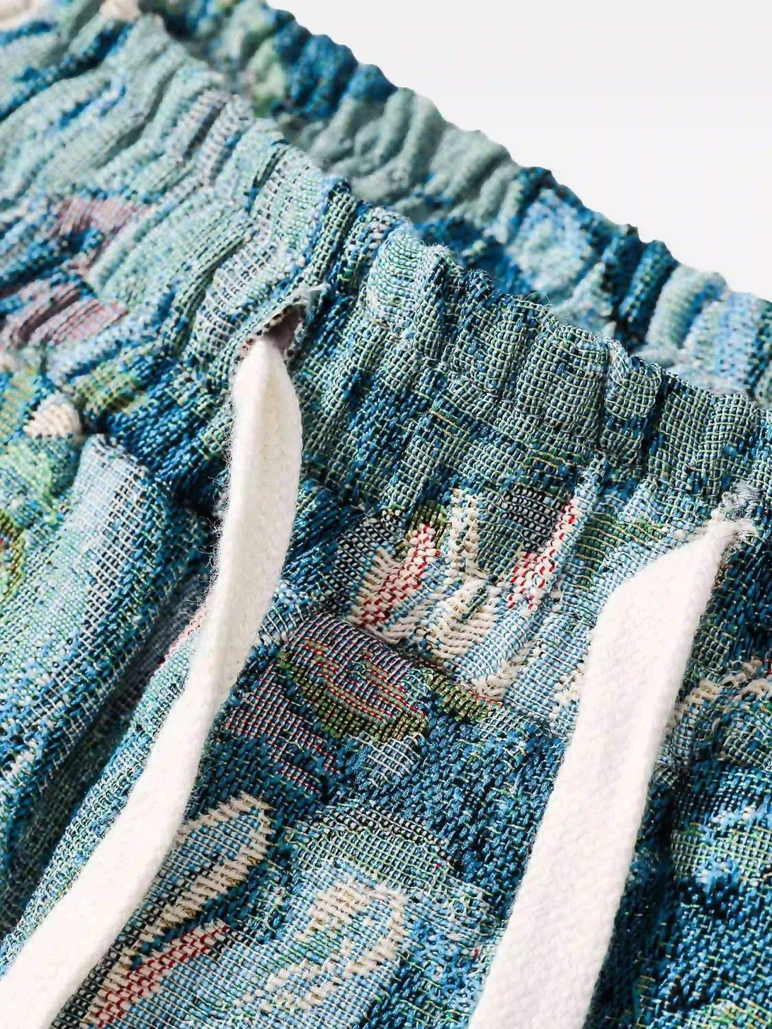 Intricate look at the jacquard embroidery on shorts by TALISHKO, highlighting texture and design.
