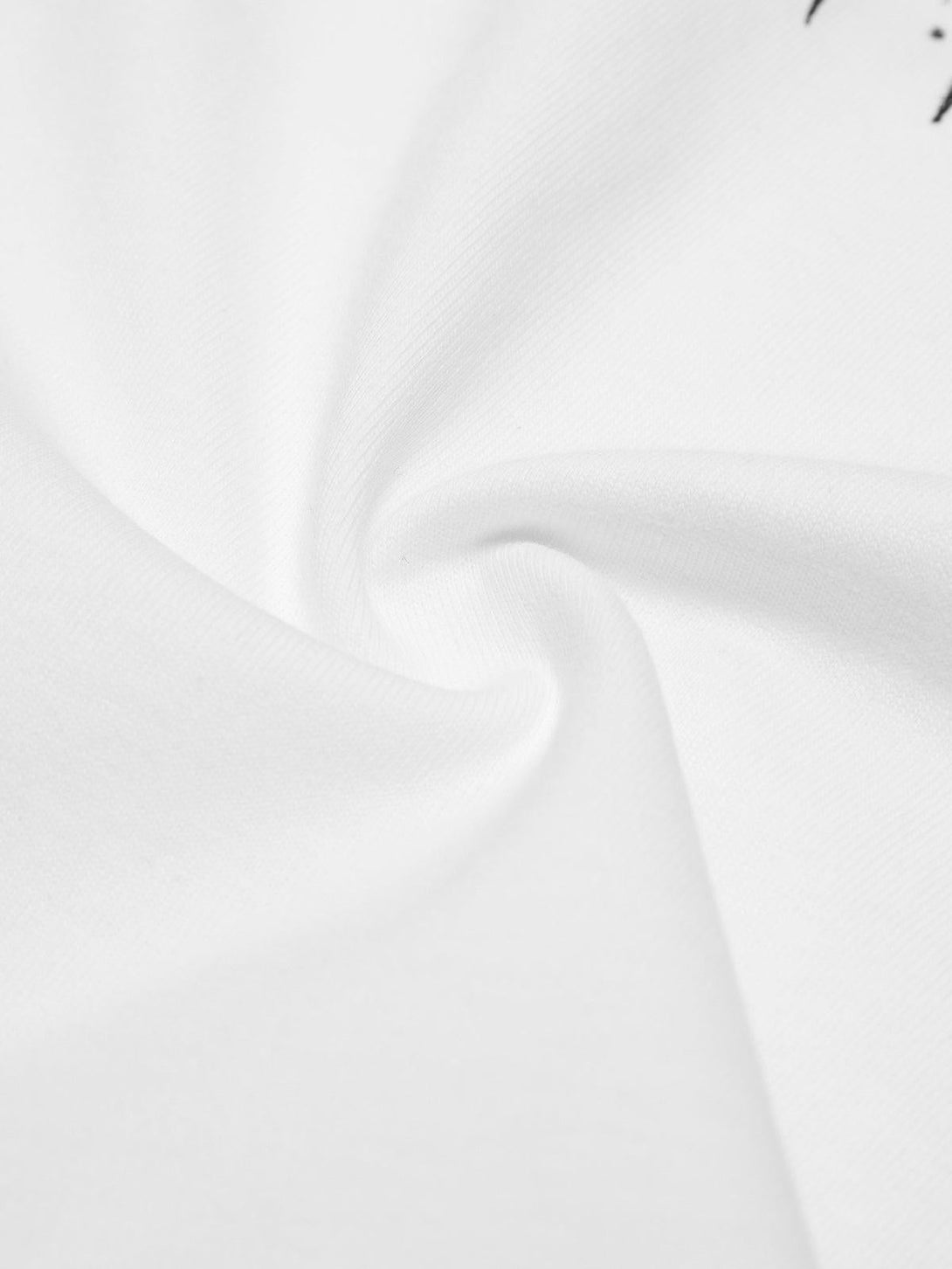 Intricate look at the TALISHKO white T-shirt's fabric, highlighting its smooth texture.