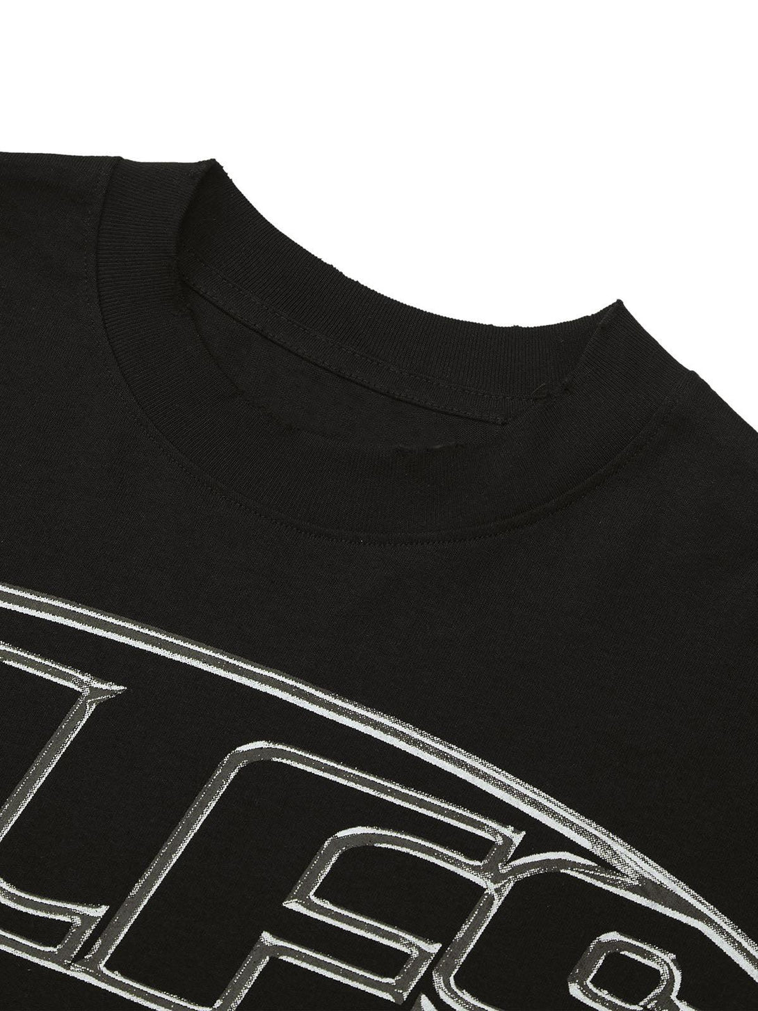 A tight crop highlighting the TALISHKO black T-shirt's bold graphic lettering design.