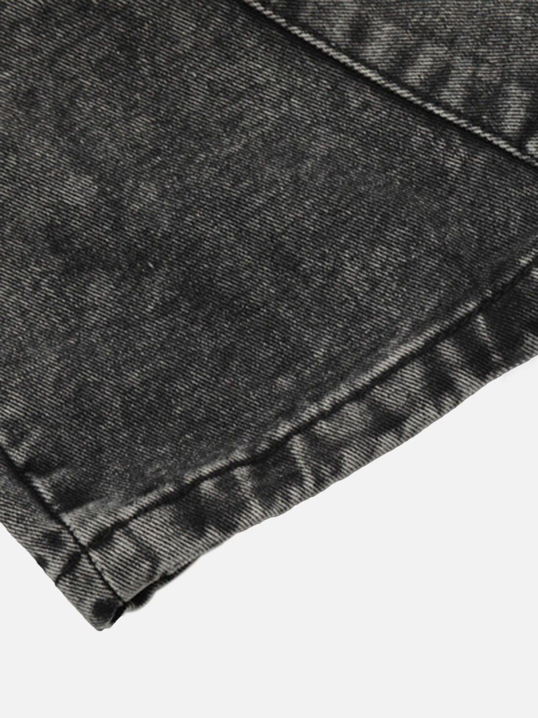 Zoomed-in texture of TALISHKO's loose drawstring trousers, highlighting fabric detail.