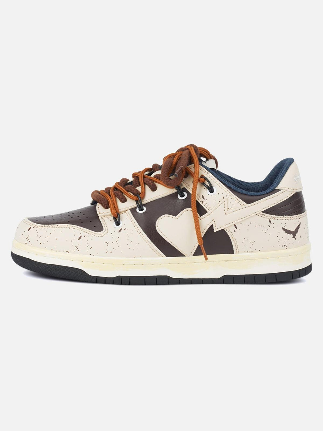 Side view of TALISHKO sneakers in cream and brown, featuring a heart design and bold laces.