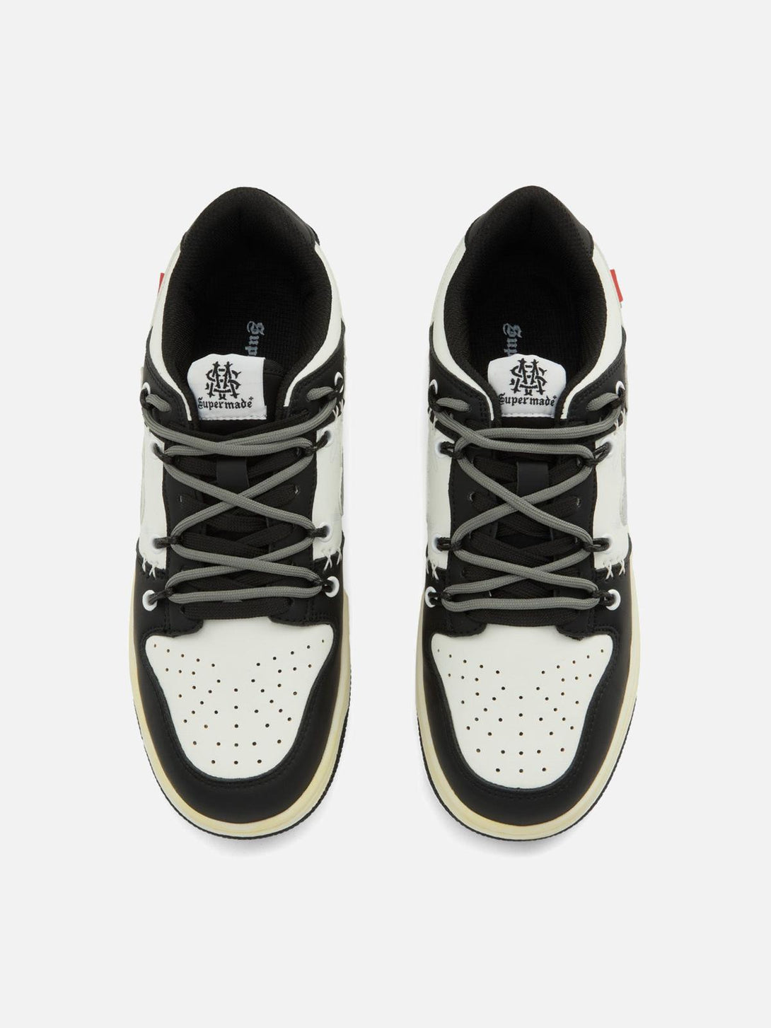 Top view of TALISHKO High Street Love Sneakers showcasing black and white design with gray laces.