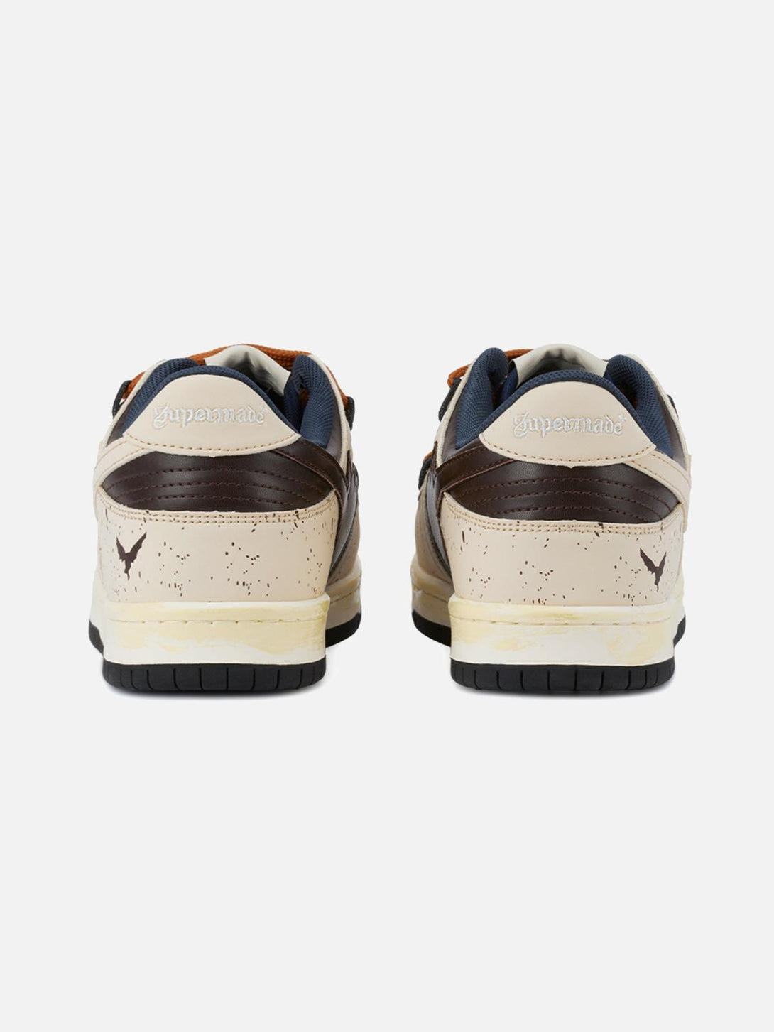 Rear view of TALISHKO sneakers in cream and brown, highlighting speckled design details.