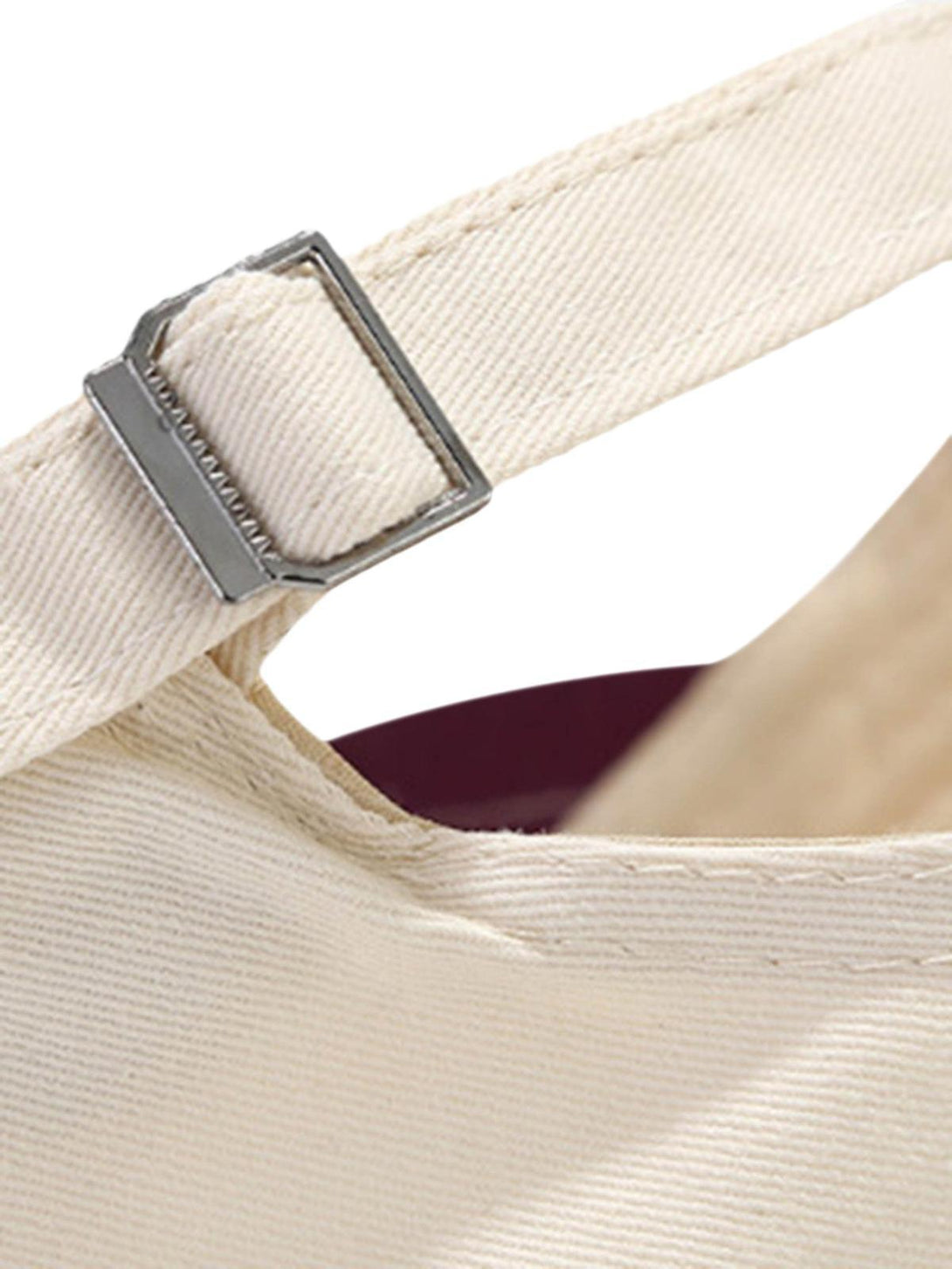 A close-up of TALISHKO hat's adjustable strap, highlighting the detailed stitching and metal buckle.