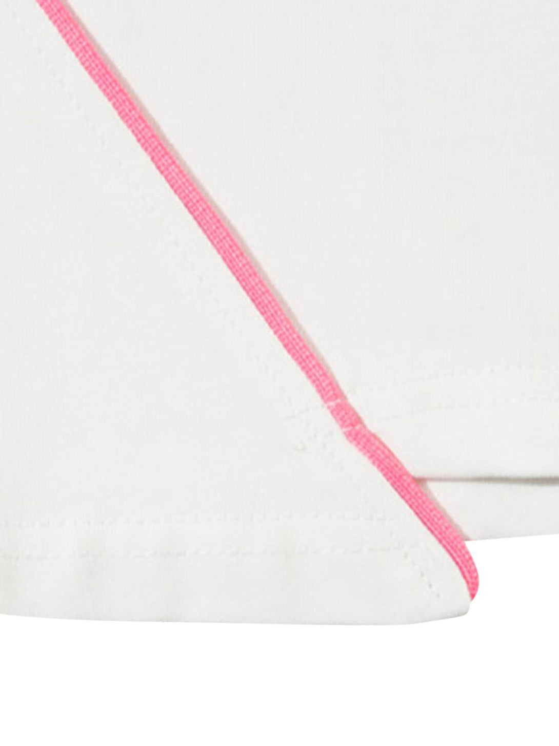 A tight crop highlighting pink seam details on a white TALISHKO asymmetric T-shirt.