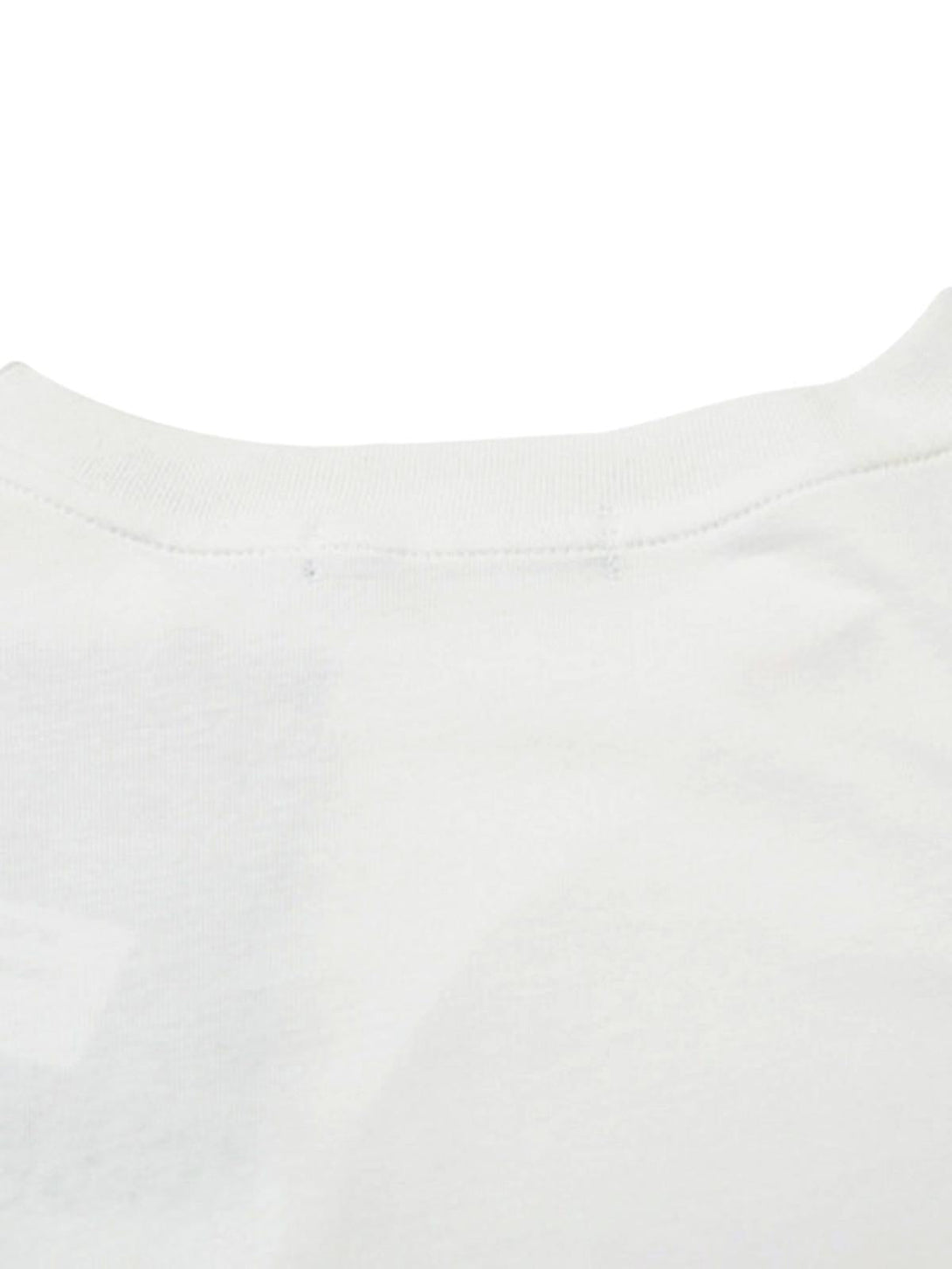 A close-up of the neckline on a white asymmetric T-shirt by TALISHKO, highlighting stitching detail.