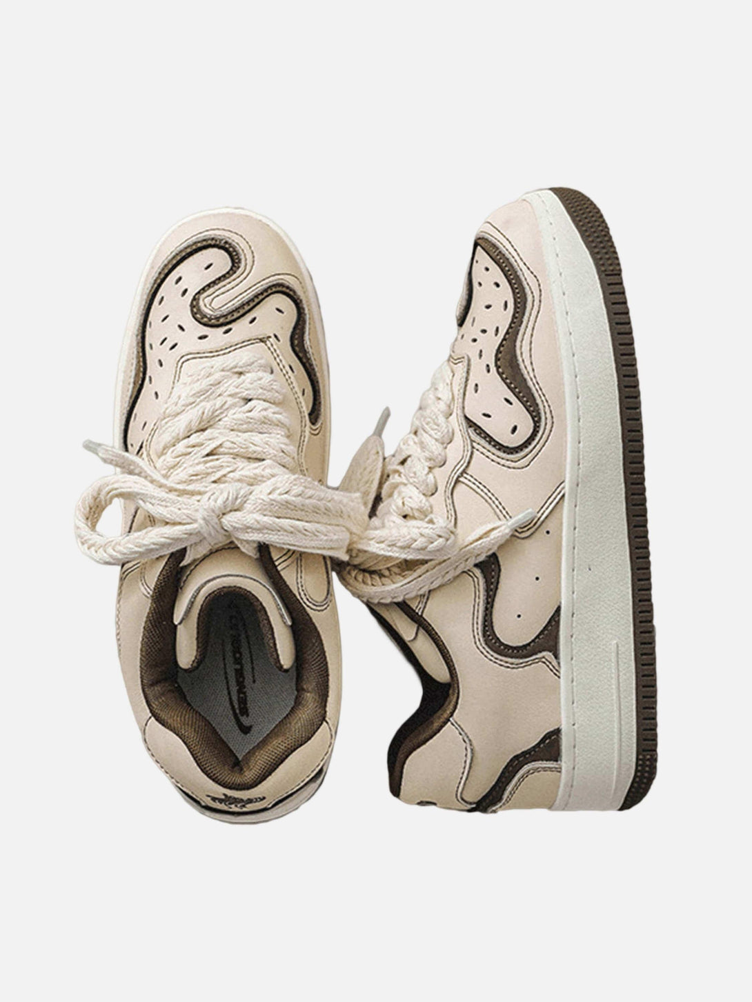 TALISHKO skateboard shoes in beige and brown with bold patterns and thick laces, showcasing streetwear flair.