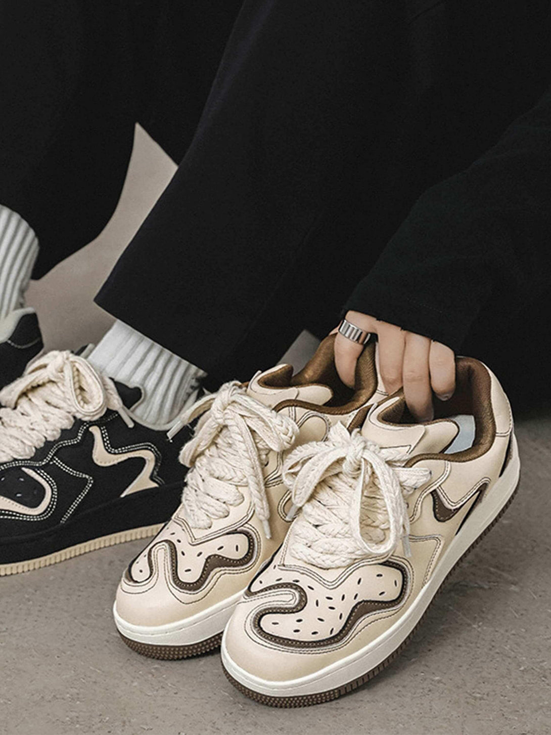 TALISHKO skateboard shoes in beige with thick laces, paired casually for a stylish street look.