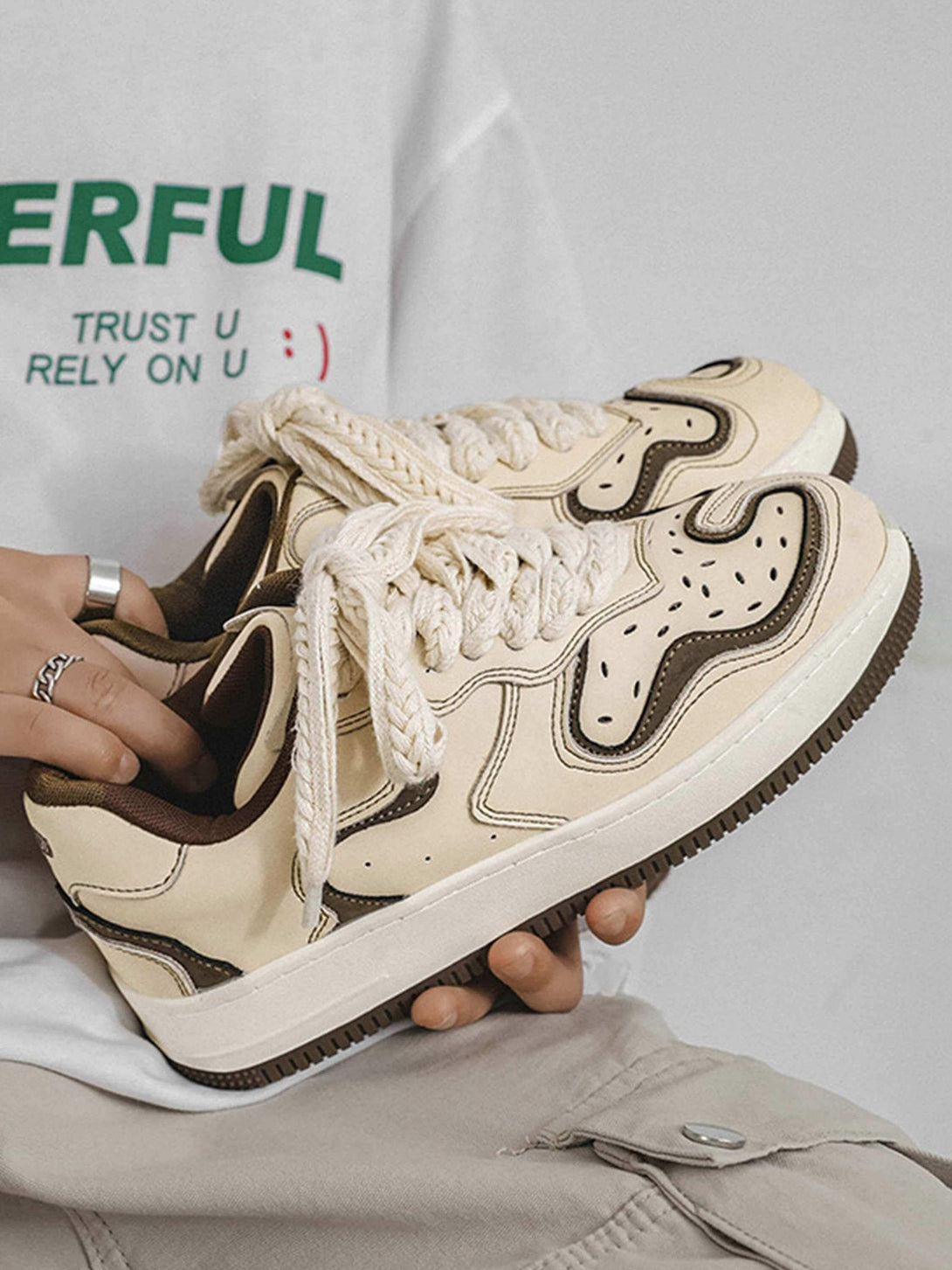 TALISHKO skateboard shoes in beige with bold patterns and thick laces, perfect for casual style.